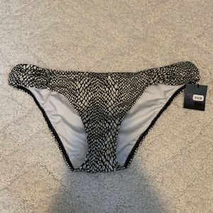 Woman’s bikini bottom. Black/white, size medium. New with tags.